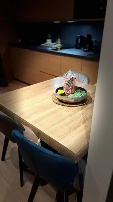 a table with a plate of food and a cup on it at Ski ou Thermes? Un appt cabine avec vue magnifique in Saint-Gervais-les-Bains