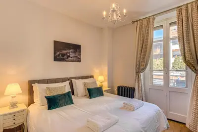 a bedroom with a bed and a window at Apartment Aiguille du Midi Central Chamonix - Alpes Travel - Sleeps 6 in Chamonix-Mont-Blanc