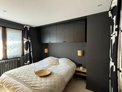 a bedroom with a bed with a bowl on it at Appartement F2 Bis centre de Megève in Megève