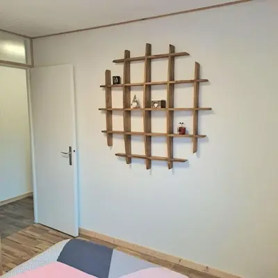 a room with a shelf on the wall at Casa Peghera, Chamonix (hypercentre) in Chamonix-Mont-Blanc