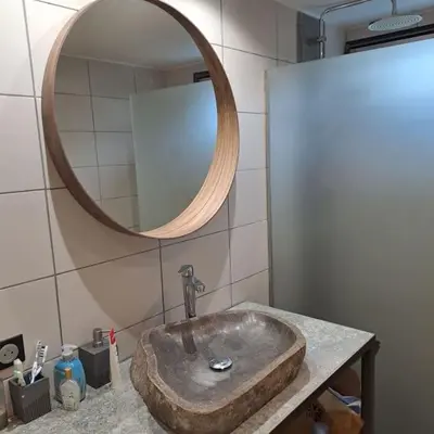 a bathroom with a stone sink and a mirror at Casa Peghera, Chamonix (hypercentre) in Chamonix-Mont-Blanc