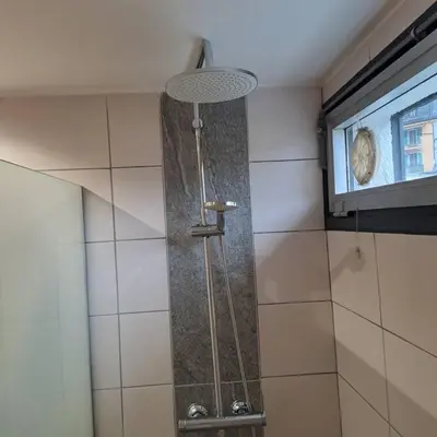 a shower in a bathroom with a window at Casa Peghera, Chamonix (hypercentre) in Chamonix-Mont-Blanc