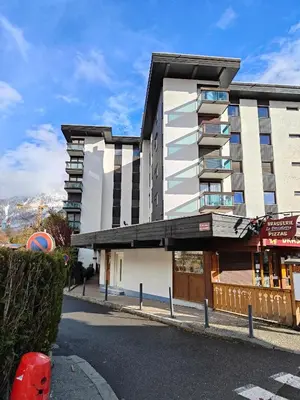 a building on a street in front of a building at Casa Peghera, Chamonix (hypercentre) in Chamonix-Mont-Blanc