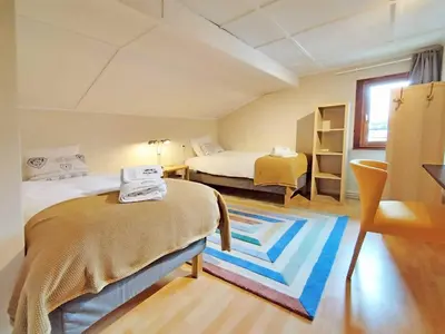 a dining room with a table and yellow chairs at Edelweiss 3 Apartment in Chamonix-Mont-Blanc