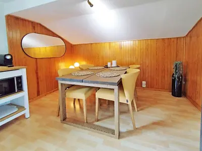 an image of a house with mountains in the background at Edelweiss 3 Apartment in Chamonix-Mont-Blanc