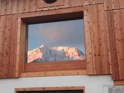 a window with a view of a mountain at Chalet 3 chambres, 11 personnes près du domaine skiable, parking gratuit, Chez Pépé à Saint-Gervais in Saint-Gervais-les-Bains