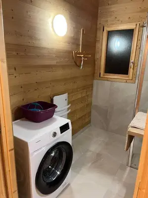 a washing machine with a bowl on top of it in a bathroom at Chalet 3 chambres, 11 personnes près du domaine skiable, parking gratuit, Chez Pépé à Saint-Gervais in Saint-Gervais-les-Bains