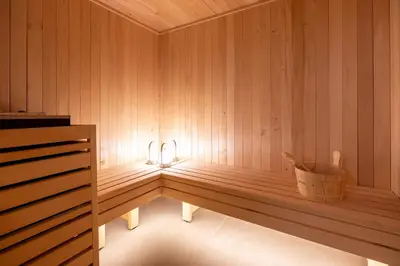 a bedroom with two bunk beds and a mirror at Chalet Seven Summits - Pool - Sauna - Jacuzzi - By Cozee Rentals in Chamonix-Mont-Blanc