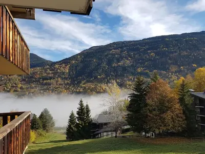 a view of a lake from a house at Etoile des Alpes in Saint-Gervais-les-Bains