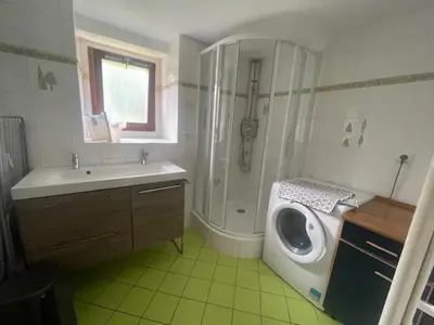 a bathroom with a shower and a sink and a toilet at Particulier loue 2 appartements communicants dans chalet à Samoëns jusqu à 16 couchages in Samoëns