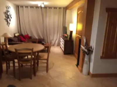 two bunk beds in a room with a desk at Bel appartement au Lays in Arâches-la-Frasse