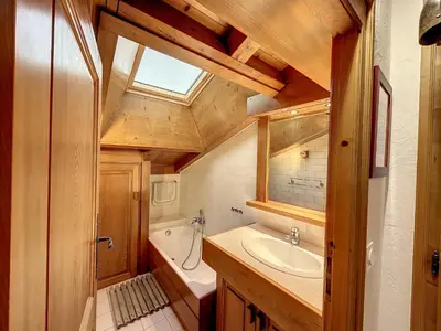 a bathroom with a sink and a tub and a window at Appartement 3 pièces proche pistes à Combloux avec parking - FR-1-560-117 in Combloux
