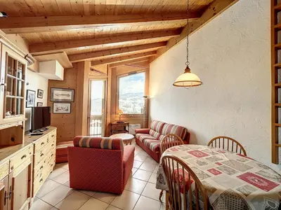 a kitchen and living room with a table and chairs at Appartement 3 pièces proche pistes à Combloux avec parking - FR-1-560-117 in Combloux