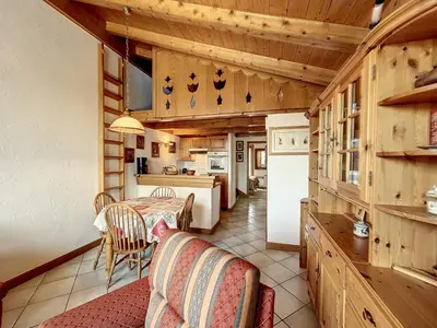 a kitchen and dining room with a table and chairs at Appartement 3 pièces proche pistes à Combloux avec parking - FR-1-560-117 in Combloux