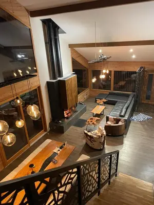 a large living room with a couch and a fireplace at Chalet Cristal II in Les Contamines-Montjoie