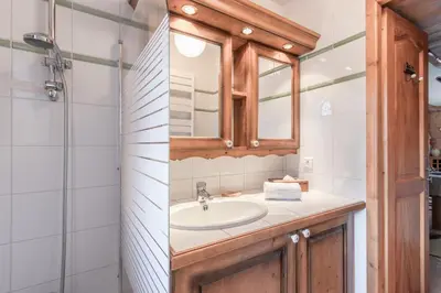 a bathroom with a sink and a mirror at Les Grandes Jorasses - Calme - Duplex in Les Houches