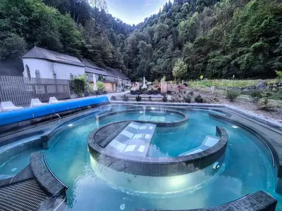 a swimming pool with a mountain in the background at Andro in Chamonix-Mont-Blanc