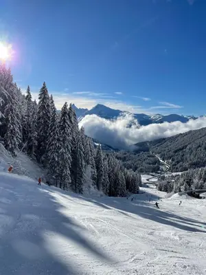a group of people skiing down a snow covered slope at Resort central apartment ideal for up to 2 people in Les Carroz d'Araches