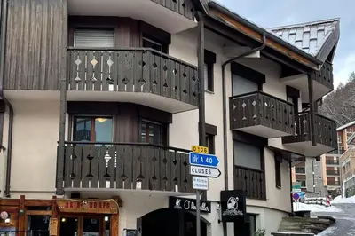 a building with balconies on the side of it at Resort central apartment ideal for up to 2 people in Les Carroz d'Araches
