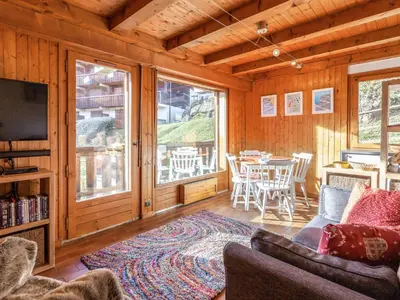 a large wooden building with snow in front of it at Apartment Les Grets-9 by Interhome in Saint-Gervais-les-Bains