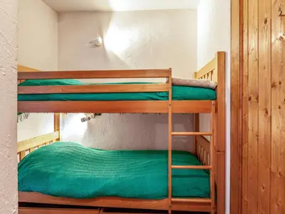 a hallway with a door to a room with bunk beds at Apartment Les Grets-9 by Interhome in Saint-Gervais-les-Bains