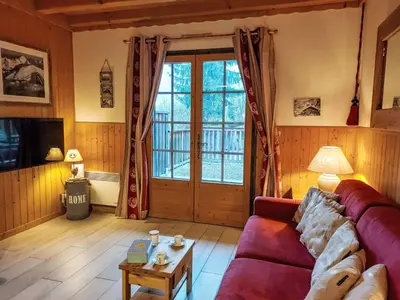 a living room with a couch and a table at Apartment Le clos Alpin by Interhome in Saint-Gervais-les-Bains