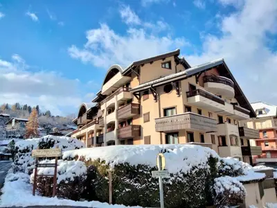 a building with a statue on the side of it at Apartment Jardins Alpins 2 by Interhome in Saint-Gervais-les-Bains