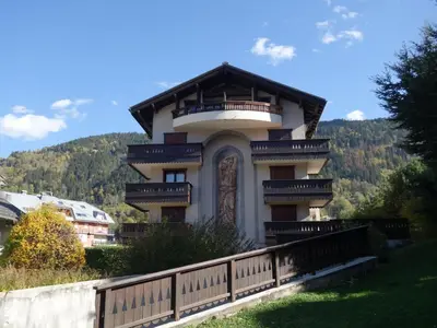a building with balconies on the side of a hill at Apartment Jardins Alpins 2 by Interhome in Saint-Gervais-les-Bains