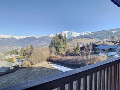 a balcony with a view of a snowy mountain at Duplex 3 pièces au cœur de Combloux, proche navette ski, balcon Mont Blanc, parking et casier à skis - FR-1-560-120 in Combloux