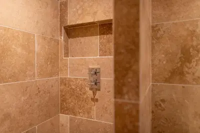 a bathroom with a shower with a glass door at Apartment with terrace and parking heart of Megève in Megève