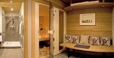 a room with a shower and a bench in a bathroom at Les Granges d'en Haut - Chamonix Les Houches in Les Houches