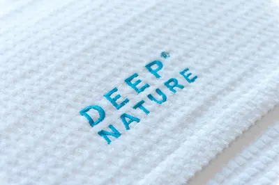 a close up of the word happy on a white blanket at Les Granges d'en Haut - Chamonix Les Houches in Les Houches
