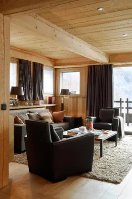 a living room with couches and a table at Les Granges d'en Haut - Chamonix Les Houches in Les Houches
