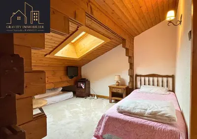 a bedroom with a bed and a skylight at Chalet 4 pièces + Mezzanine , Les Carroz in Les Carroz d'Araches