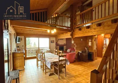 a dining room with a table and chairs in a cabin at Chalet 4 pièces + Mezzanine , Les Carroz in Les Carroz d'Araches