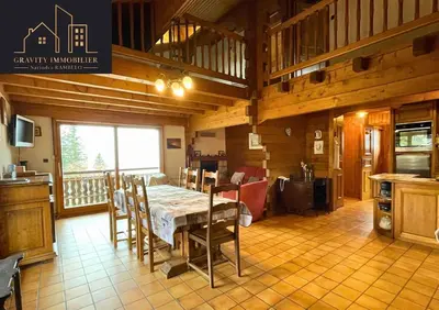 a kitchen and dining room with a table and chairs at Chalet 4 pièces + Mezzanine , Les Carroz in Les Carroz d'Araches