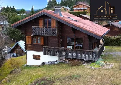 a large wooden house with a large balcony at Chalet 4 pièces + Mezzanine , Les Carroz in Les Carroz d'Araches