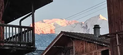 a view of a snow covered mountain from a building at Appartement 1 chambre idéalement situé in Domancy