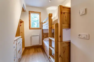 a bedroom with bunk beds in a house at Apartment Chalet des Granges in Les Houches
