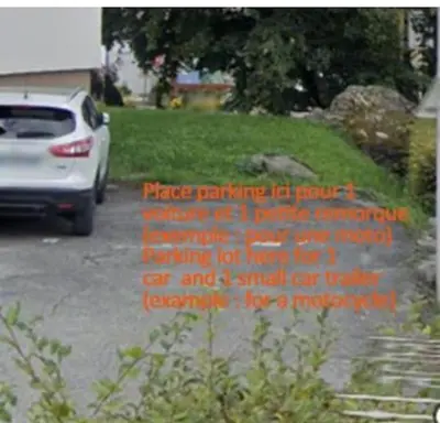 a car parked in a parking lot with writing on it at Studio cabine 4 personnes, votre refuge montagnard in Saint-Gervais-les-Bains