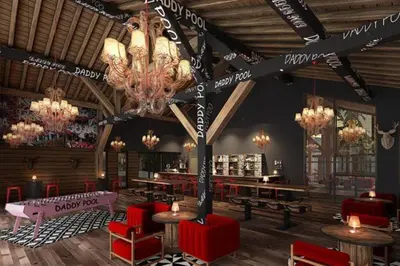 a large room with tables and chairs and a chandelier at L'Altima Megève - Eclat des Veriaz in Megève