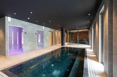a pool in the middle of a house at L'Altima Megève - Eclat des Veriaz in Megève