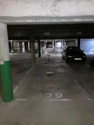 a parking garage with a car parked in it at Pied des pistes/Hyper centre/Balcon/Parking in Chamonix-Mont-Blanc