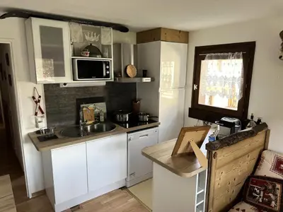 a small kitchen with a sink and a microwave at Résidence Le Royal - Charmant T3 dans le centre de Combloux MAE-2721 in Combloux