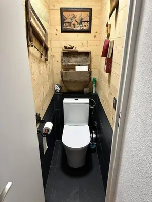 a small bathroom with a toilet in a room at Résidence Le Royal - Charmant T3 dans le centre de Combloux MAE-2721 in Combloux