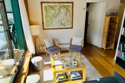 a living room with a couch and a table at Beautiful apartment with superb view of Mont Blanc in Chamonix-Mont-Blanc