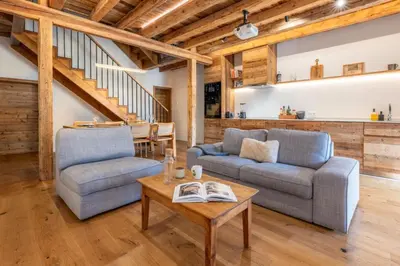 a living room with two chairs and a table at Pretty loft with view of Mont Blanc & glacier in Chamonix-Mont-Blanc