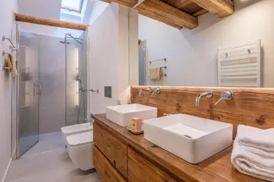 a bathroom with two sinks and a shower at Pretty loft with view of Mont Blanc & glacier in Chamonix-Mont-Blanc