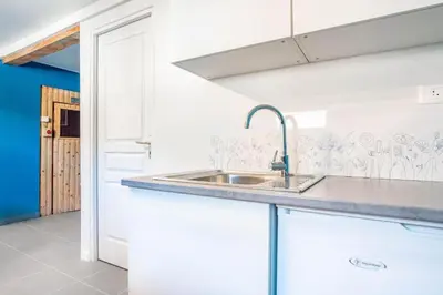 a kitchen with a sink and a counter top at Chalet La Cordée, 160m2, 4 chambres, sauna in Saint-Gervais-les-Bains