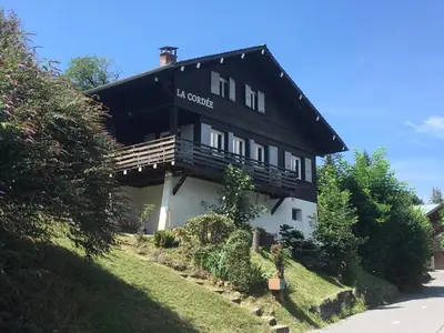 a black and white building on the side of a road at Chalet La Cordée, 160m2, 4 chambres, sauna in Saint-Gervais-les-Bains